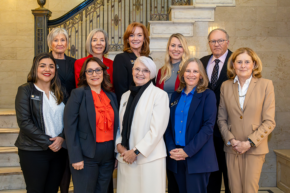 Group photo with State Board of Education members and Commissioner Susana Cordova. Taken in lobby of Colorado Department of Education 201 E Colfax building, February 2025.