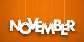 The word November in with each white letter hanging from the top of the image by a screen with an orange background.